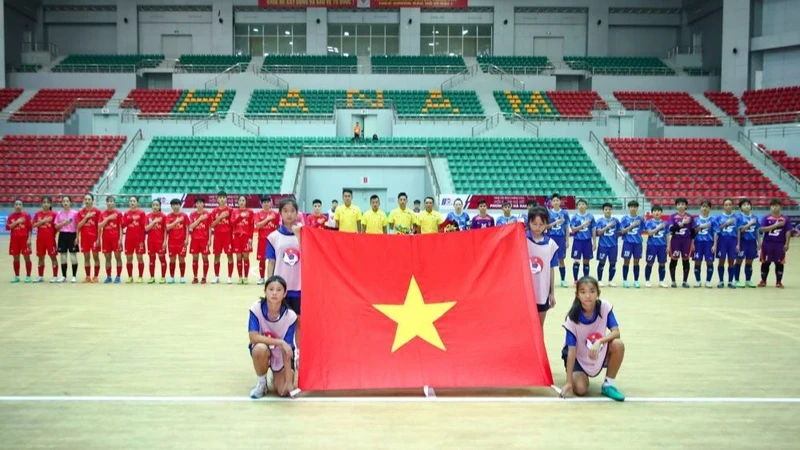 Teams perform the flag-raising ceremony before entering the first round of matches after the opening ceremony.