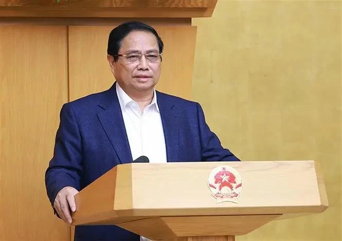 Prime Minister Pham Minh Chinh speaks at the December 4 conference carrying out the review of the implementation of Resolution No. 18-NQ/TW. (Photo: VNA)