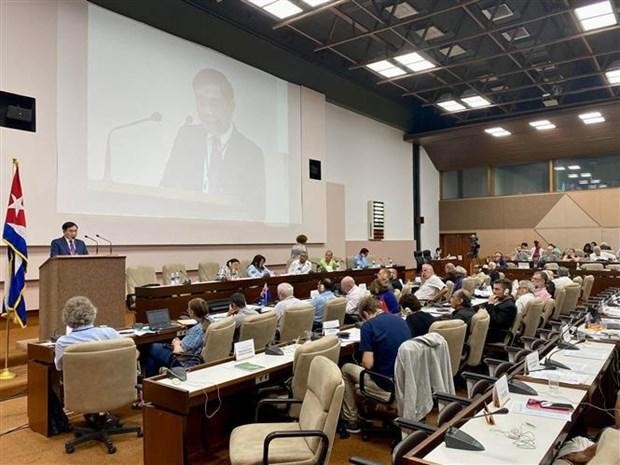 Deputy head of Party Central Committee's Commission for Internal Affairs Tran Quoc Cuong speaks at the 22nd IMWCP (Photo: VNA)