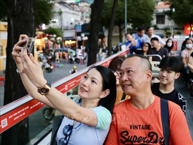 Tourists ride a double-decker bus in Ho Chi Minh City (Photo: VNA)