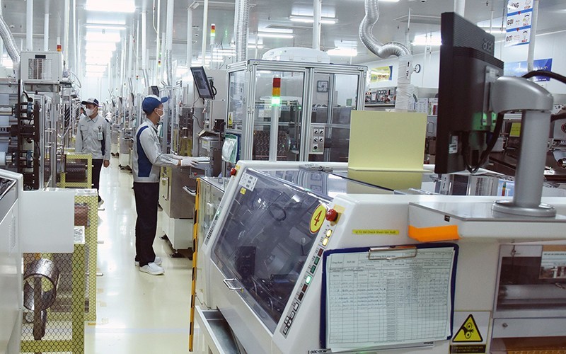 Manufacturing printed circuit boards for electronic devices at the Nippon Mektron factory of Mektec Manufacturing Vietnam Ltd., at the Thang Long II Industrial Zone in Yen My District and My Hao Town, Hung Yen Province.