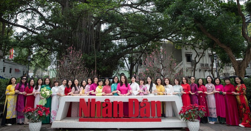 Female staff of Nhan Dan Newspaper embrace Ao Dai Week.