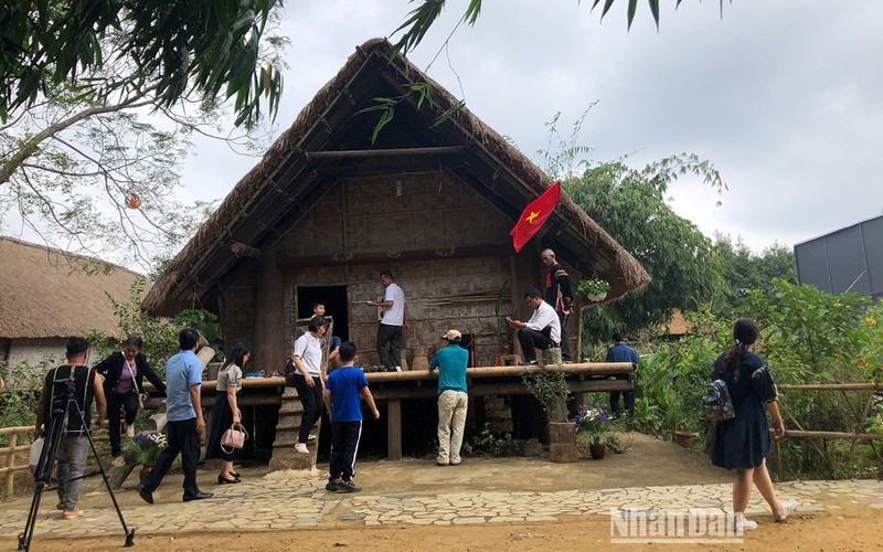 Tourists visit the Cultural Village.
