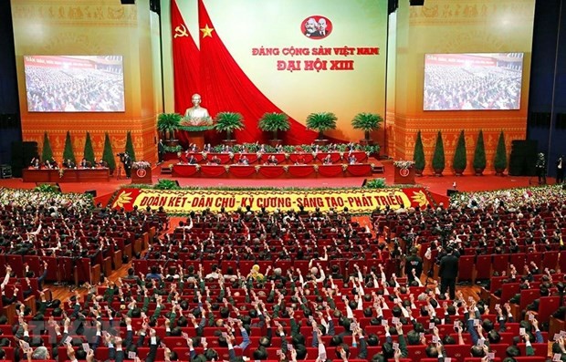 Deputies vote to approve the 13th National Party Congress's Resolution (Photo: VNA)