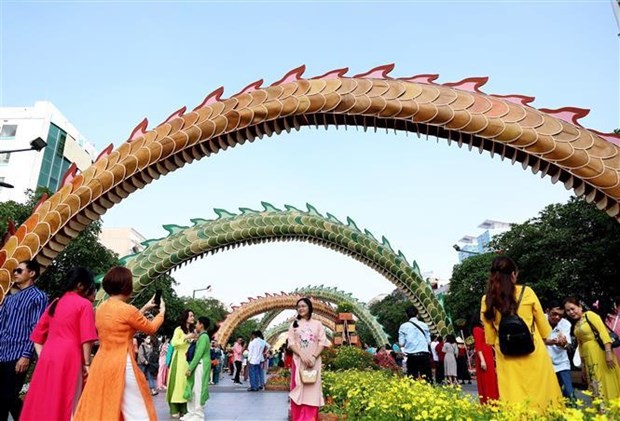 People visit Nguyen Hue flower street in Ho Chi Minh City during Tet. (Photo: VNA)