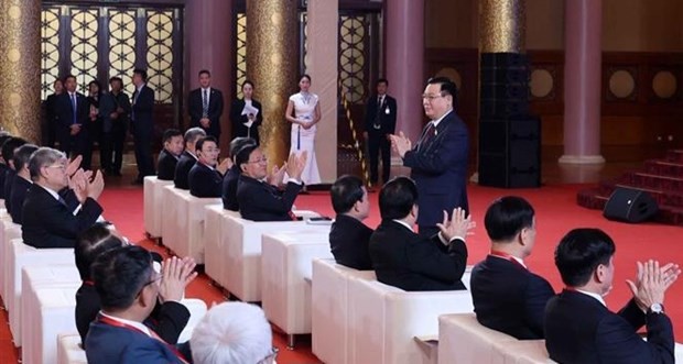 National Assembly Chairman Vuong Dinh Hue attends the seminar in Beijing on April 9. (Photo: VNA)