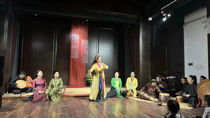 Performing traditional arts in the Hanoi's Old Quarter space.