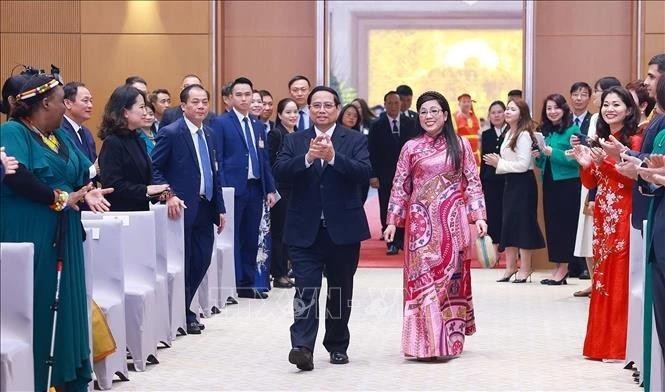 PM Pham Minh Chinh and his spouse at the banquet (Photo: VNA)