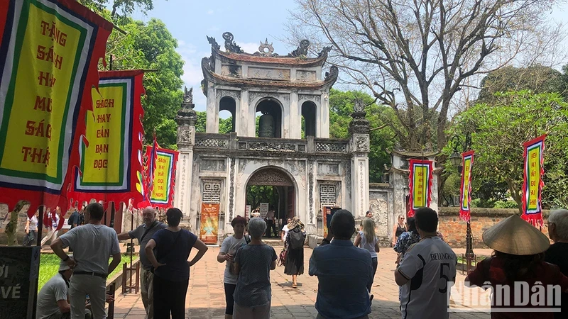 Foreign tourists visit the Temple of Literature, Hanoi.