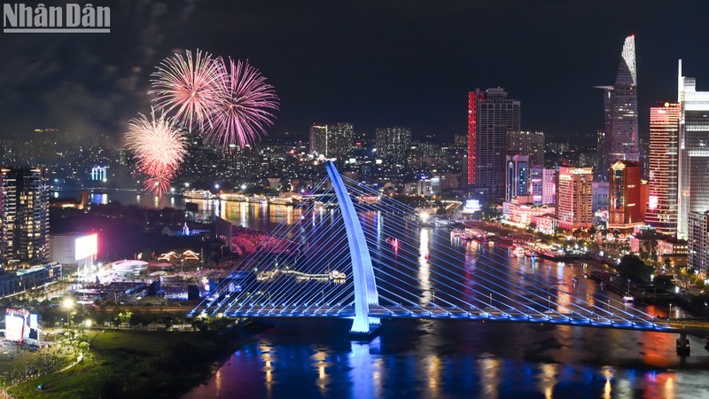 Reunification anniversary fireworks dazzle night sky above Saigon River