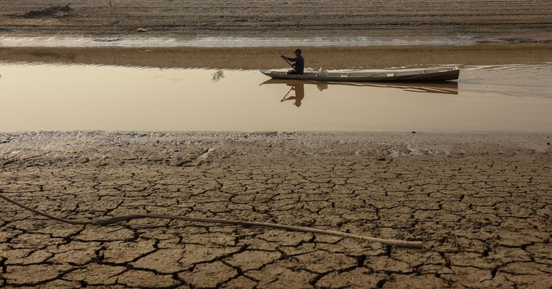 A person on a boat navigates on Puraquequara Lake, which has been affected by drought, in Manaus, Brazil, October 6, 2023. (Photo: Reuters)