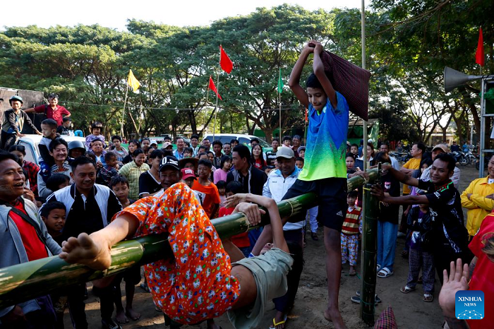 Children compete in a pillow-fighting game during an event marking the 77th Anniversary of Independence Day in Nay Pyi Taw, Myanmar, Jan. 4, 2025. Myanmar on Saturday celebrated the 77th Anniversary of Independence Day with various events being held across the country. (Photo: Xinhua)