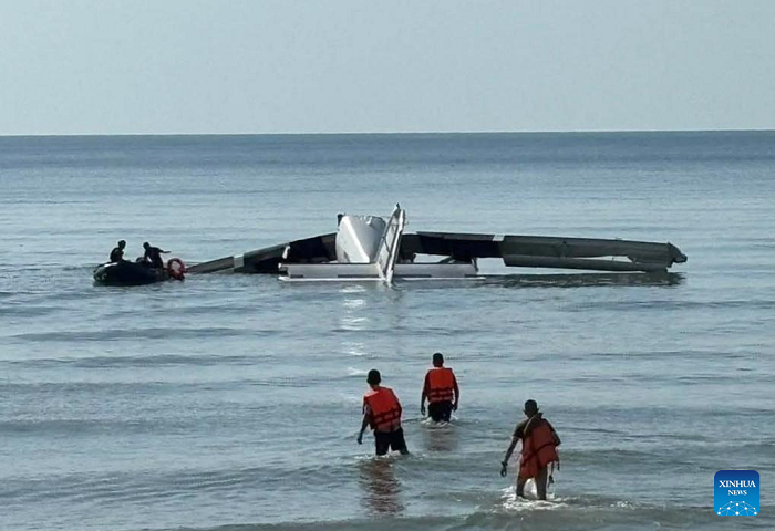 A police plane is seen crashing into the sea off Cha-am District, Phetchaburi Province, Thailand, April 25, 2025. The plane crashed near the shore of Thailand's resort town of Hua Hin on Friday morning, killing six people, the Thai police said. The police said the accident took place when the plane was conducting a test flight for parachute training. (Photo: Xinhua)