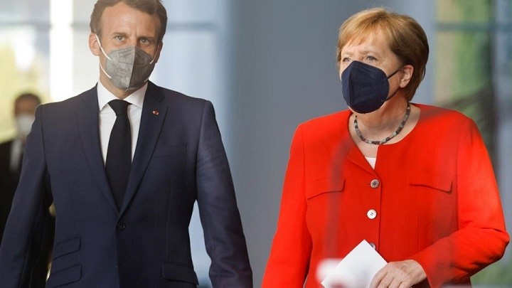 German Chancellor Angela Merkel and French President Emmanuel Macron arrive to give a news statement in Berlin, Germany, June 18, 2021. (Photo: Reuters)