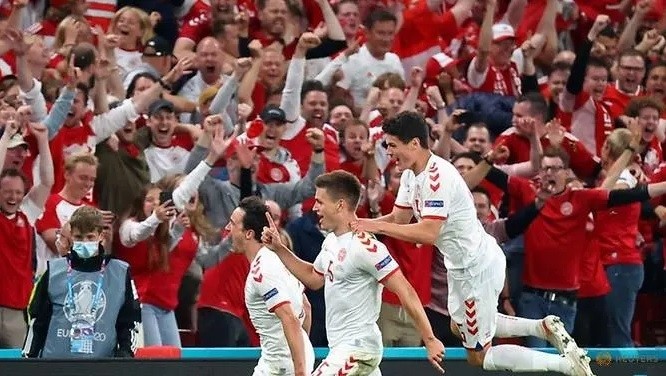Denmark's Joakim Maehle celebrates scoring their fourth goal with Thomas Delaney and Christian Norgaard. (Photo: Reuters)