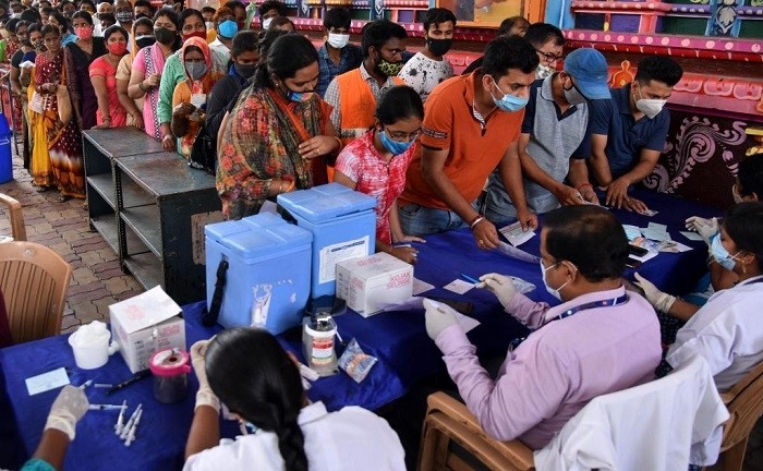 People line up to register at a COVID-19 vaccination site in Hyderabad, India, on June 26, 2021. (Str/Xinhua)
