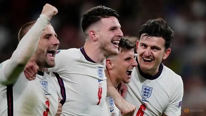 England's Harry Maguire celebrates with teammates after the match on Jul 7, 2021. (Photo: Reuters)