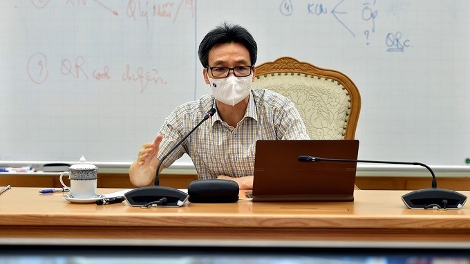 Deputy PM Vu Duc Dam speaking at the teleconference. (Photo: VGP)