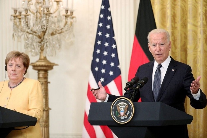US President Joe Biden and German Chancellor Angela Merkel attend a joint news conference in the East Room at the White House in Washington, US, July 15, 2021. (Photo: Reuters)