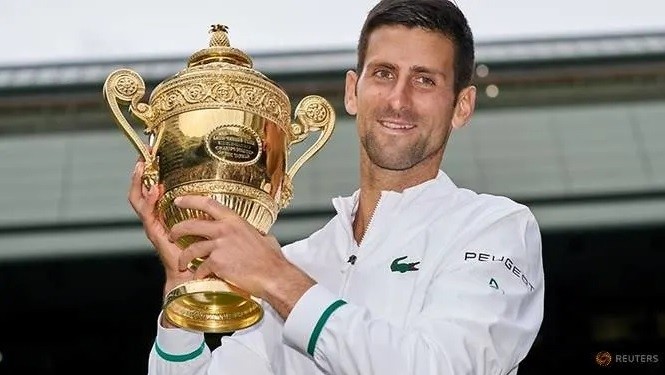 FILE PHOTO: Jul 11, 2021; London, United Kingdom; Novak Djokovic (SRB) holds the trophy after beating Matteo Berrettini (ITA) in the men's final on Centre Court at All England Lawn Tennis and Croquet Club. (Photo: Reuters)
