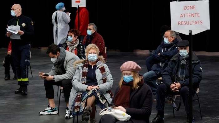People wearing face masks wait for their test results at a COVID-19 testing centre in Dunkirk, France, on February 18, 2021. (Photo: Reuters)