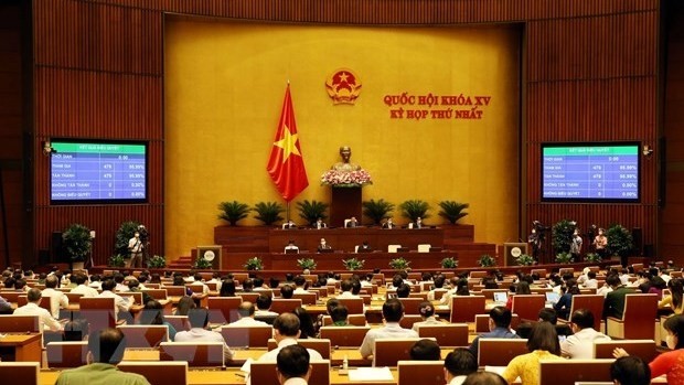 With 95.99% of yes votes, the 15th National Assembly on July 28 adopts a resolution on the organisational structure and number of members of the Government (Photo: VNA)