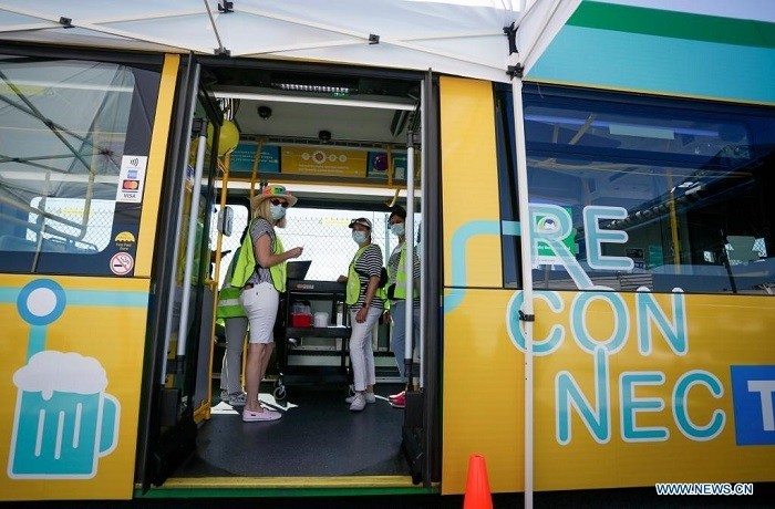 Healthcare workers are seen on a COVID-19 "vaccine bus" at Tsawwassen Ferry Terminal in Delta, British Columbia, Canada, on July 30, 2021. The "vaccine bus" is part of "Vax for B.C." campaign in British Columbia aimed at boosting up the vaccination rate. (Photo: Xinhua)