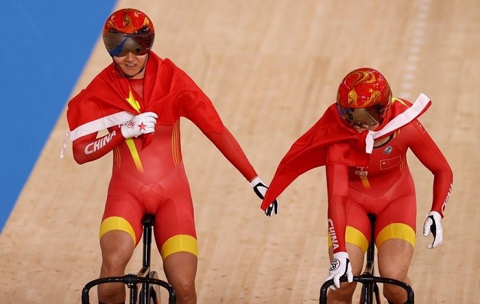 Tokyo 2020 Olympics - Cycling - Track - Women's Team Sprint - Gold Final - Izu Velodrome, Shizuoka, Japan - August 2, 2021. Bao Shanju of China and Zhong Tianshi of China celebrate winning the race and the gold medal. (Photo: Reuters)