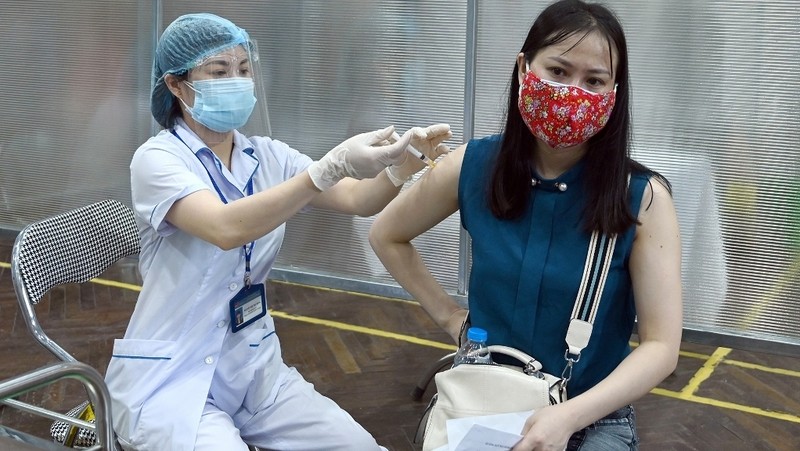 A Hanoi resident gets vaccinated against COVID-19 