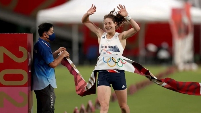 Kate French of Team Great Britain crosses the line to win gold in the Laser Run during the Women's Modern Pentathlon on day fourteen of the Tokyo 2020 Olympic Games at Tokyo Stadium in Chofu, Japan on August 06, 2021. (Photo: Getty Images)