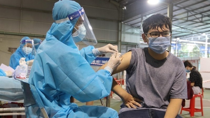 A Ho Chi Minh City resident is vaccinated against COVID-19. (Photo: VNA)