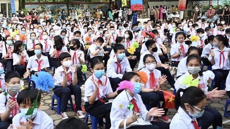 Students attend the opening ceremony for the 2020-2021 school year. (Photo: DUY LINH)