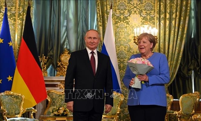 Russian President Vladimir Putin and German Chancellor Angela Merkel at a meeting in Moscow on August 20, 2021. (Photo: VNA)