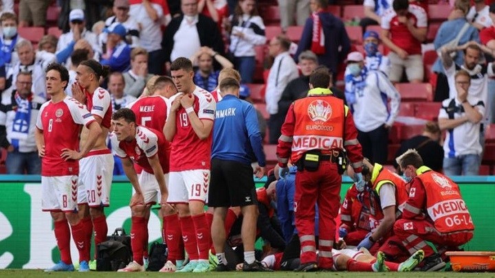 FILE PHOTO: Soccer Football - Euro 2020 - Group B - Denmark v Finland - Parken Stadium, Copenhagen, Denmark - June 12, 2021 Denmark's Jonas Wind and teammates stand in front of Christian Eriksen as he receives medical attention after collapsing during the match. (Photo: Reuters)
