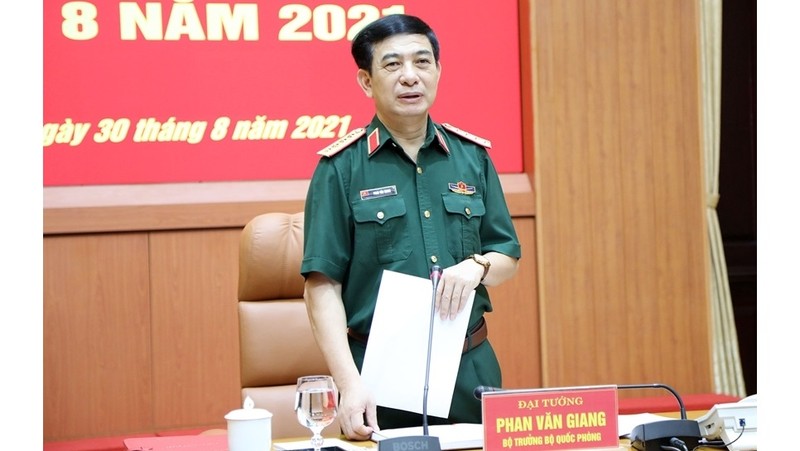 Politburo member and Minister of Defence, General Phan Van Giang speaks at the conference. (Photo: qdnd.vn)