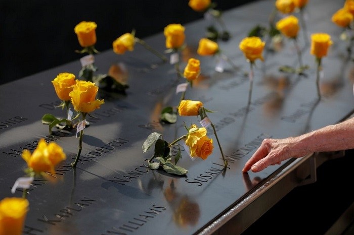 Flowers are seen in the names of victims at the National September 11 Memorial & Museum a month before the 20th anniversary of the September 11 attacks in Manhattan, New York City, US, August 11, 2021. (Photo: Reuters)