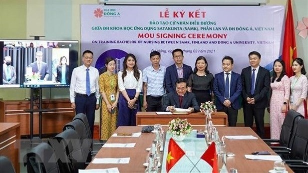 At a signing ceremony between Vietnamese and Finnish universities. (Photo: VNA) 