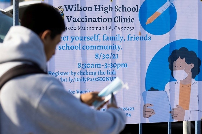Los Angeles County school officials ordered vaccinations for all students aged 12 and over, the largest school district in the United States to take that step.