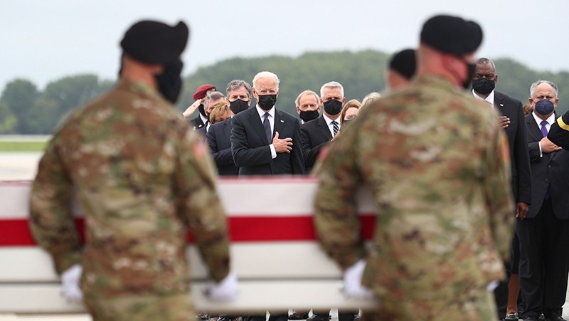 US President Joe Biden salutes during the dignified transfer of the remains of U.S. Military service members killed by a suicide bombing at the Hamid Karazi International Airport, at Dover Air Force Base in Dover, Delaware, US, August 29, 2021. (Photo: Reuters)