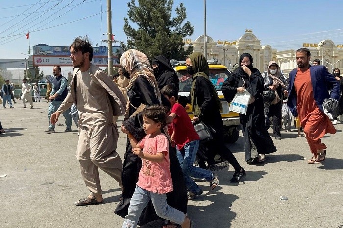 People try to get into Hamid Karzai International Airport in Kabul, Afghanistan August 16, 2021. (Photo: Reuters/Stringe)