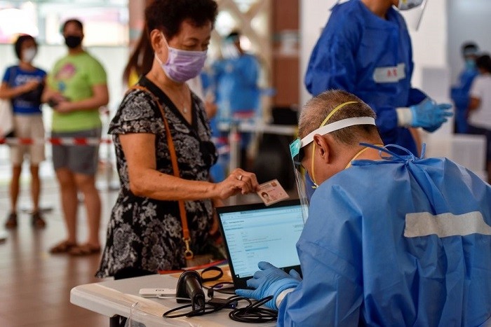 Singapore, which has one of the world's highest COVID-19 vaccination rates, is seeing encouraging signs that the number of severe cases is not rising at the same pace as new infections, a senior health official said on Friday.