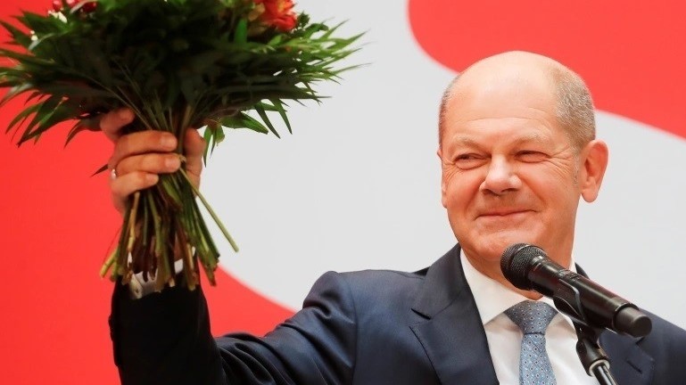 SPD leader Olaf Scholz celebrates his party's victory in the German election. (Photo: Reuters)
