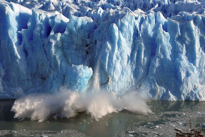 Splinters of ice peel off from one of the sides of the Perito Moreno glacier in a process of a unexpected rupture during the southern hemisphere's winter months, near the city of El Calafate in the Patagonian province of Santa Cruz, southern Argentina, in this July 7, 2008 file photo. ( Source: Reuters)
