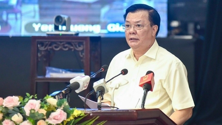 Secretary of the Hanoi Municipal Party Committee Dinh Tien Dung speaking at the event