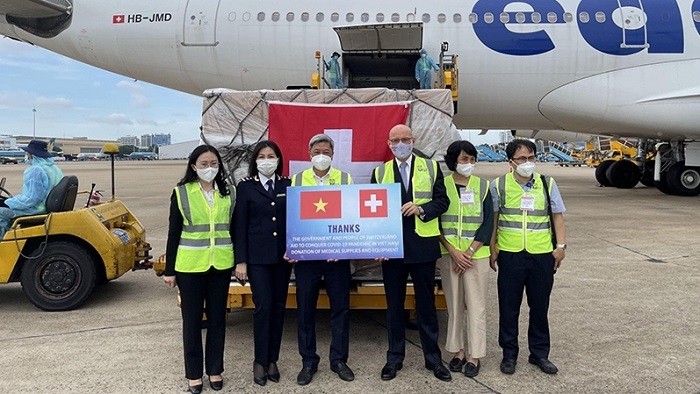 At the handover ceremony of an aid package including 13 tonnes of medical supplies from the Swiss Government to Vietnam at Tan Son Nhat Airport, Ho Chi Minh City, on October 13, 2021.