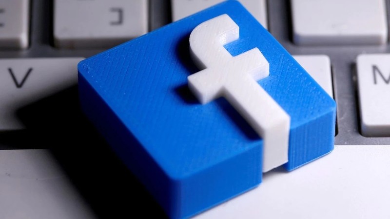 A 3D-printed Facebook logo is seen placed on a keyboard. (Photo: Reuters)