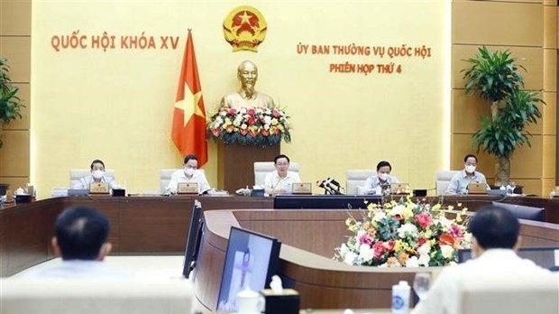 NA Chairman Vuong Dinh Hue (centre) speaks at the event. (Source: VNA)