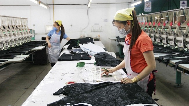 Workers from Yung Yang Embroideries Limited Company in Tan Phu District, Ho Chi Minh City, maintained production during social distancing days.