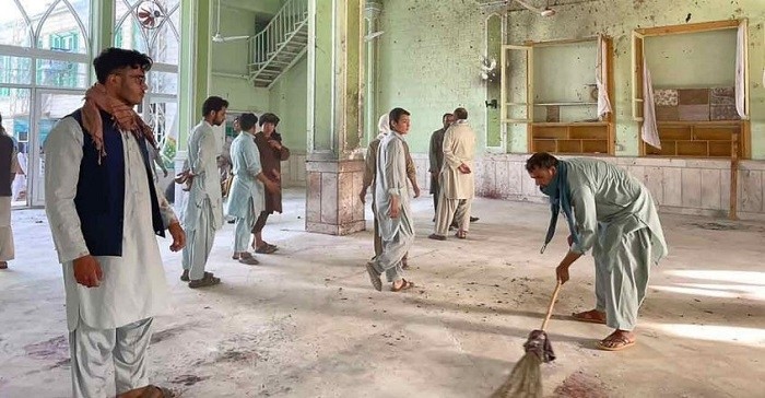 Afghan men inspect the damages inside a Shiite mosque in Kandahar after a suicide bomb attack during Friday prayers. (Photo: AFP)  