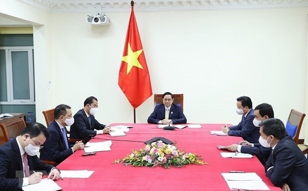 Prime Minister Pham Minh Chinh held online talks with his UK counterpart Boris Johnson on October 26. (Photo: VNA)